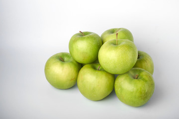 Perfect fresh green Apple with lemon isolated on a white background in full depth of field with a cropped trajectory.