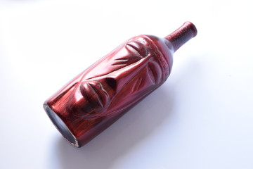 African sculpture on bottle, Selective focus on middle with white background
