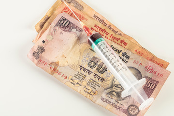 concept of crisis in India caused by virus,  vaccine on banknote