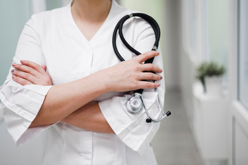 Close-up female doctor holding stethoscope