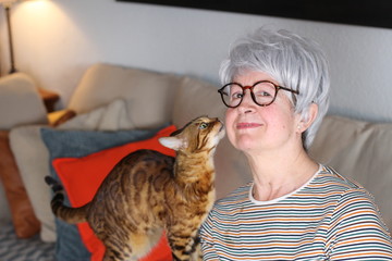 Senior woman showing complicity with her pet