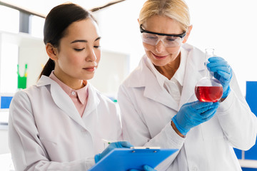 Front view of female scientists with surgical gloves in the laboratory