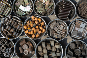 Hangs, bearings, and other mounting hardware in box, closeup, top view