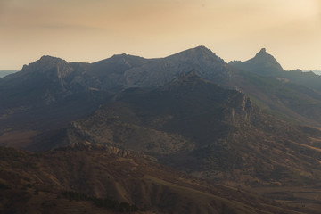 Obraz na płótnie Canvas Mountains mountain peaks in the light of the sun two