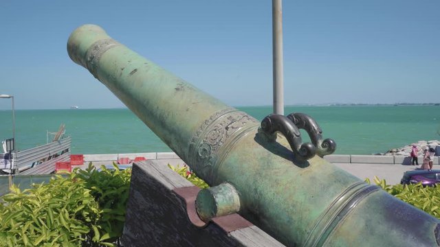 The Historic Seri Rambai Cannon At Fort Cornwallis In Penang, Malaysia Facing The Wide Blue Sea - Closeup Shot