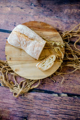fresh baked bread on wooden background
