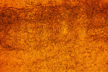 Copper colored wall texture background with textures of different shades of copper or bronze