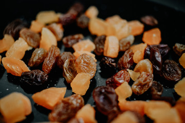 Mix of brown raisins with dried apricots