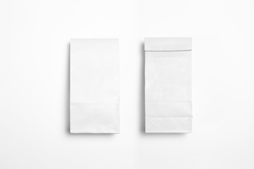 White blank Paper Packages Mock-up for dry products on white background.Front and backside. High-resolution photo.