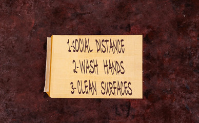 Obraz premium Coronavirus COVID-19 health safety guidelines. envelope with rules, practice social distancing, wash hands, clean surfaces, hand washing, stay home.