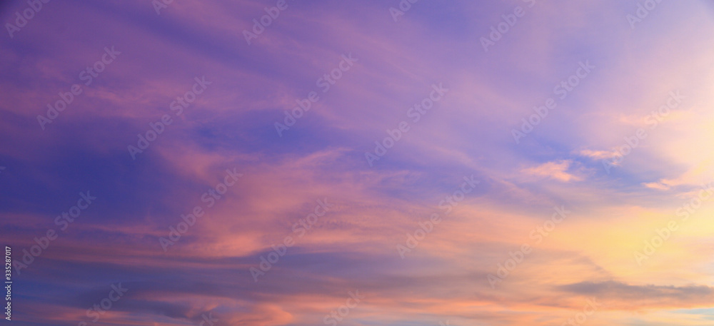 Wall mural beautiful vivid color fluffy clouds in twilight sky at evening in summer.