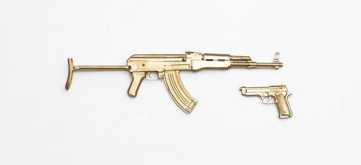 golden Kalashnikov assault rifle isolated on white background