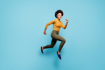 Full length body size view of nice lovely healthy cheerful active confident strong wavy-haired girl running having fun isolated on bright vivid shine vibrant blue green teal turquoise color background