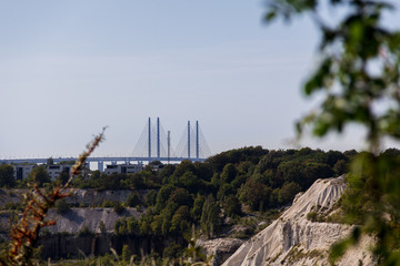 The view from the edge of the protected area called Kalkbrottet, an abandoned limestone quarry, is amazing. In the distance, the Oresund bridge is visible.