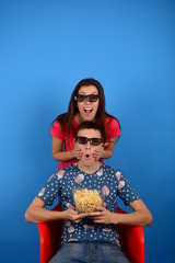 emotions on the face of a young couple in cinema