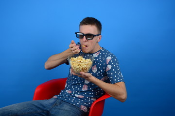 woman in 3d glasses eating popcorn