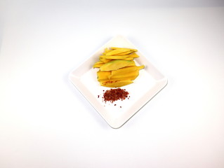 Chopped mangoes and salt chilies Isolated on a white background.