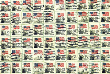 Set of USA postage stamps with USA flag. Background.