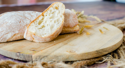 fresh baked bread on wooden background