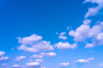 Large white clouds on a blue sky. Clear day. Background, blank for designers.