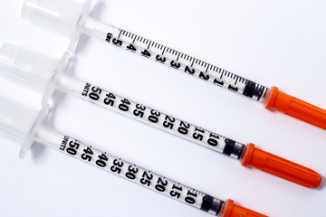 syringe over white background