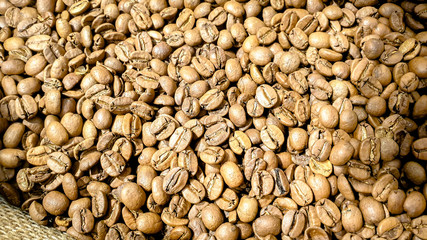 Light roasted coffee beans background, texture