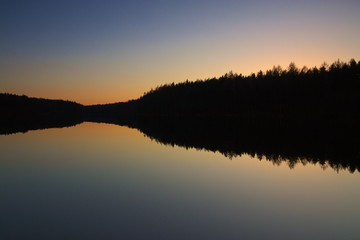 Sunset on the lake in the woods
