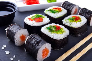 Vegetarian sushi set on a black plate