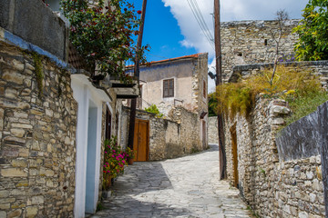 Cyprus village Lefkara. View of a village stony street with lot of green and colorful walls