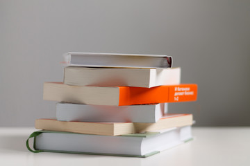 close up of a stack of books on the table