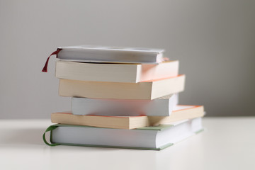 close up of a stack of books on the table