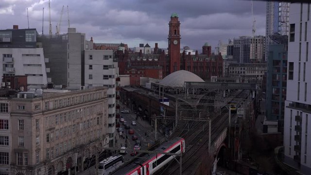 Aerial view of Manchester city centre with trains UK 4K