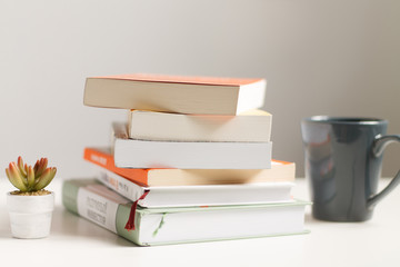 close up of a stack of books on the table