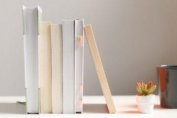 close up of a stack of books on the table