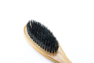 wooden brush with black artificial pile on a white isolated background close up,wooden brush with handle for cleaning clothes,wooden brush for cleaning clothes on a white isolated background