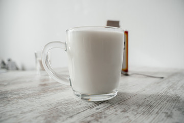 Mug with yogurt on a light background close-up