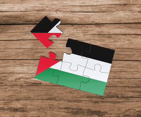 Palestine national flag on jigsaw puzzle. One piece is missing. Danger concept.