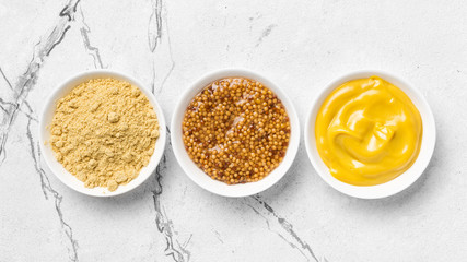 Bright set of different mustard for tasty and spicy food