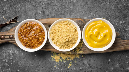 Bright set of different mustard for tasty and spicy food
