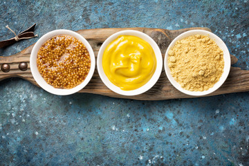 Bright set of different mustard for tasty and spicy food