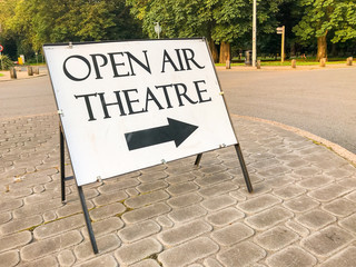 Sign showing the way to the open air theatre set up for the summer months