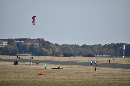 People Flying Kites At Old Abandoned Tempelhofer Feld In Tempelhof Berlin Germany