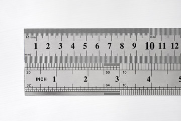 Stainless metal rulers on white background