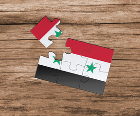Syria national flag on jigsaw puzzle. One piece is missing. Danger concept.
