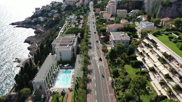 Beautiful flight over the Sunny coast of southern France. Cars drive along the road to nice along the sea. Cote d'azur, Nice. Aerial photography.