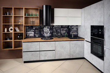 Massive cottage urban rustic loft style kitchen interior in wooden finish and granite with chalk...