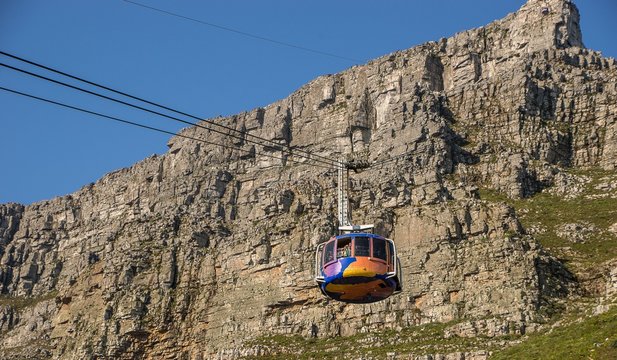 Colorful cable car in the Table Mountain National Park under the sunlight in South Africa