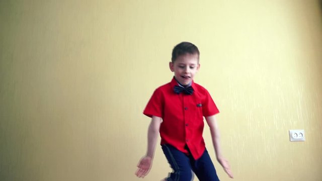 A preschool boy European is having fun at home dancing Fortnite. Dance challenge