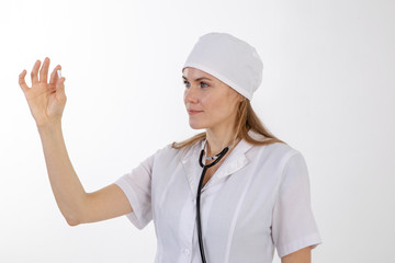 A doctor in a white coat looks at the medication.