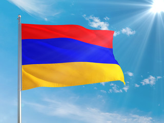 Armenia national flag waving in the wind against deep blue sky. High quality fabric. International relations concept.
